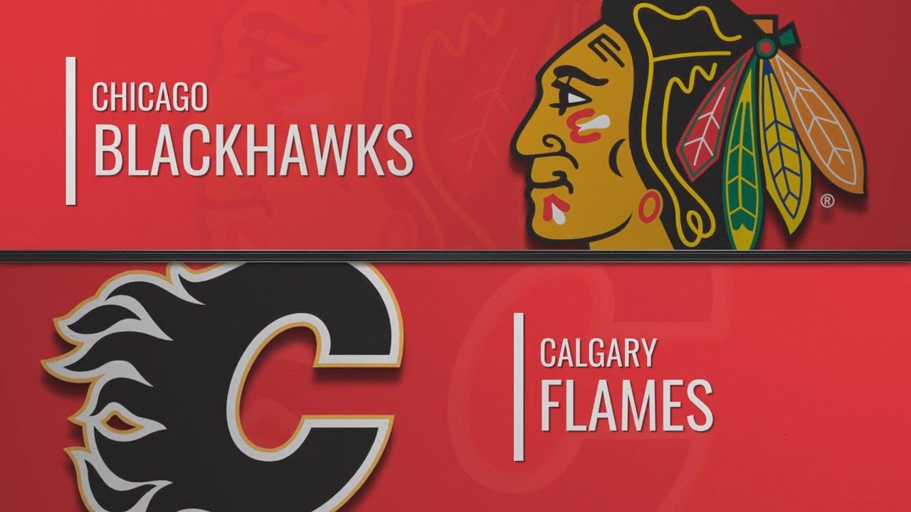 Flames chicago calgary blackhawks michael stone top globalnews ca hockey rex arbogast nhl kane goaltender period patrick charles ap mike